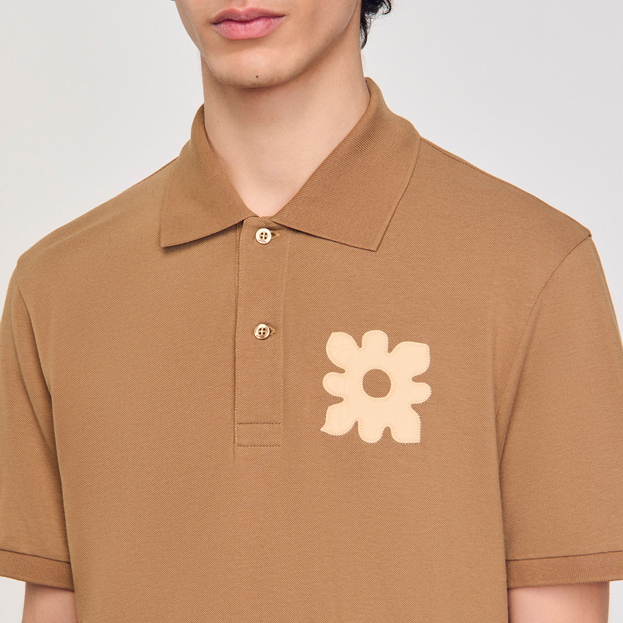 Polo à patch fleur